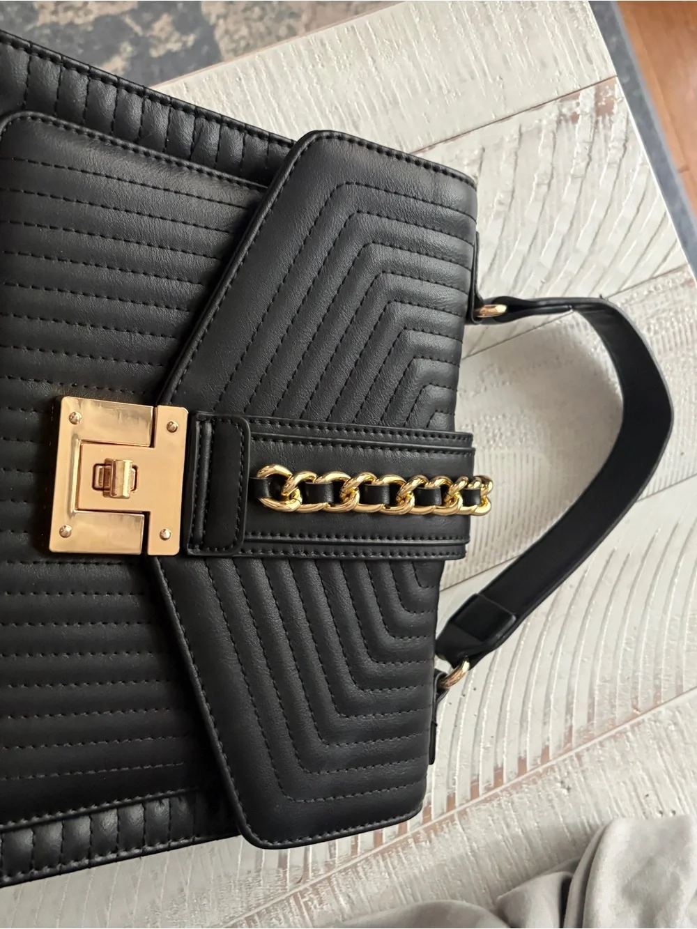 Black Quilted Leather Top-Handle Bag with Gold Chain Accent